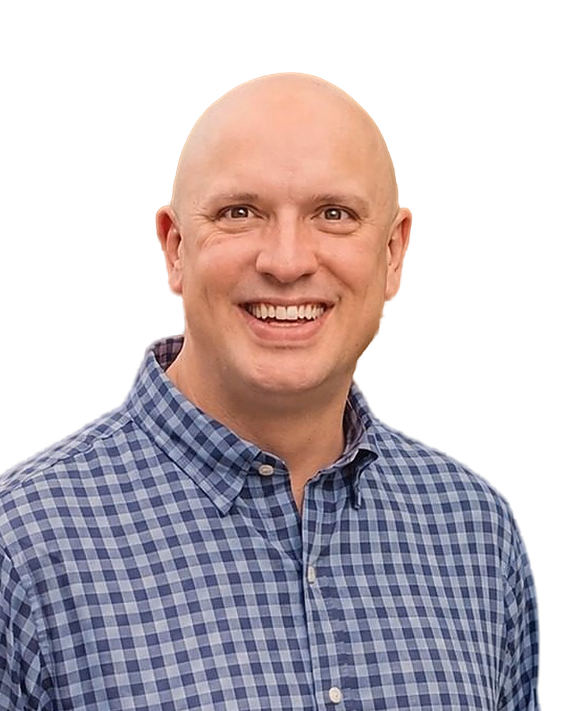 Jake, smiling, in a blue checked shirt